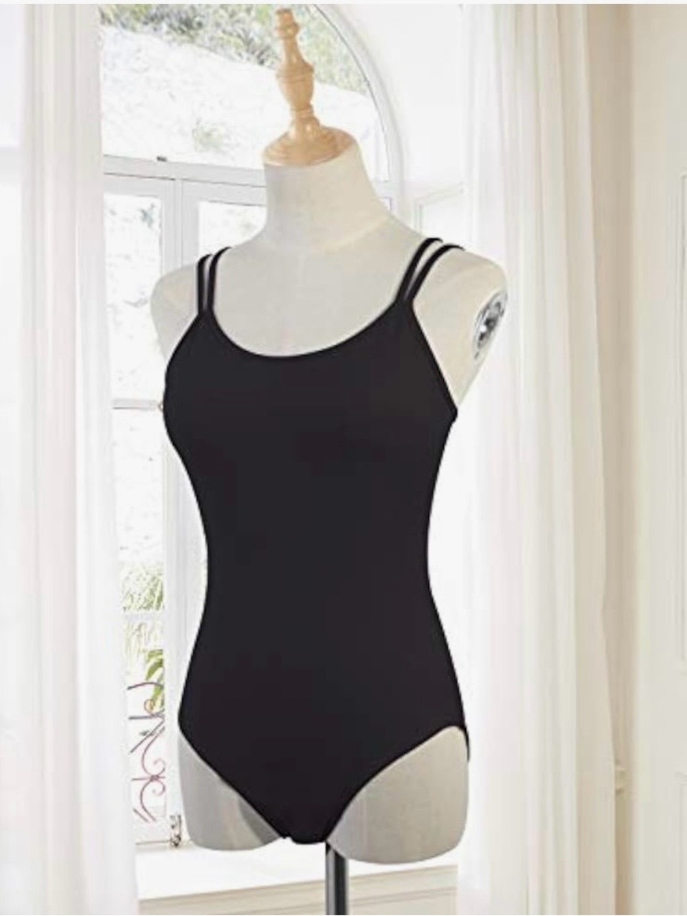 Women Leotared with bra with high cut camisole black nylon.